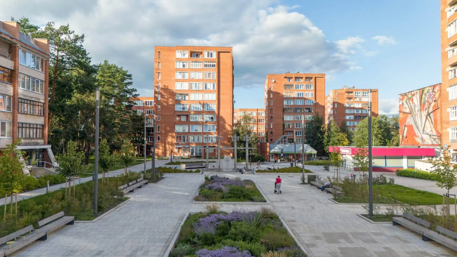 Landscape architecture project featuring a revitalised residential public square with biodiverse planting, generous pedestrian spaces, integrated seating, and mature trees. The design combines climate adaptation, social interaction, and ecological value to create a healthy and resilient urban neighbourhood.